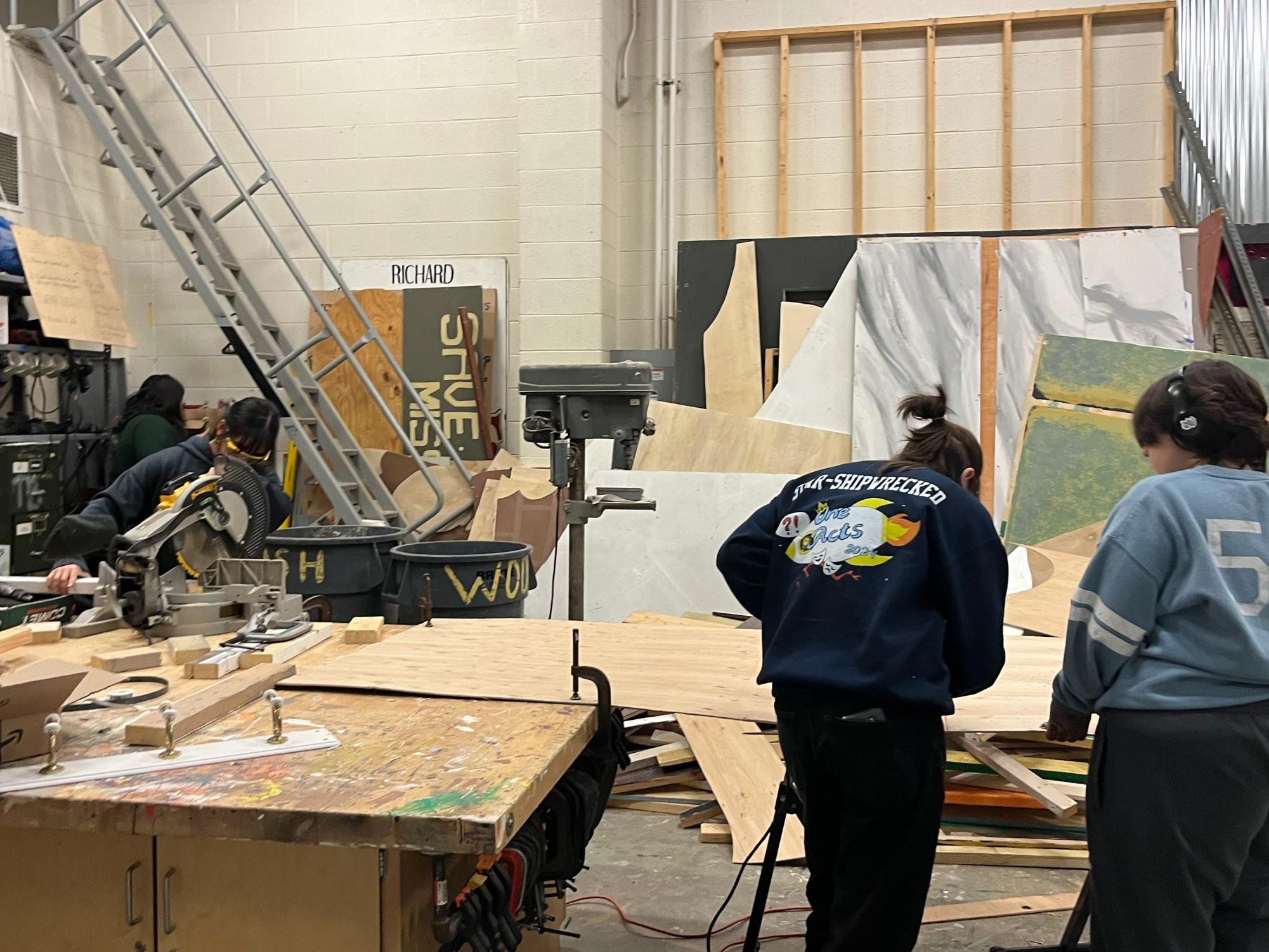 Junior Cal Murphy uses power tools to construct sets used in One Acts. (Courtesy of Liliana Katz-Hollander)