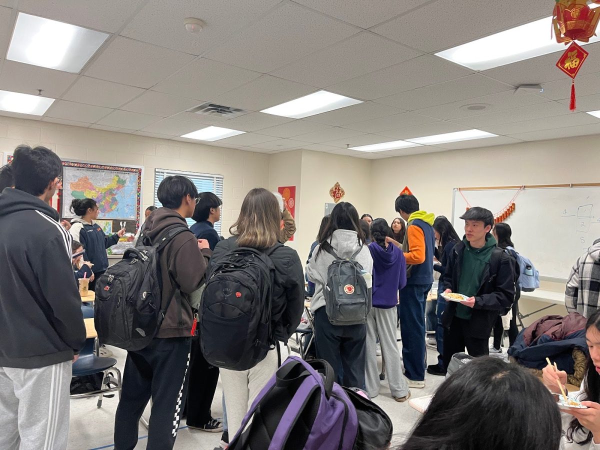 Students line up in room 161 for the NCHS Lunar New Year potluck.