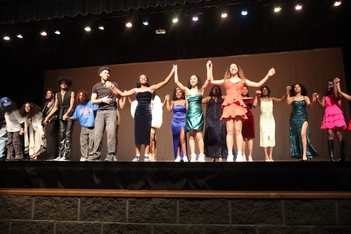 Performers and organizers bow on stage at African Diaspora Night Friday, Feb. 21.