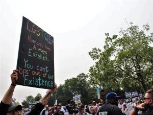 Protesters rally outside school board headquarters in June 2023 over the district's no-opt-out policy when it comes to LGBTQ+ inclusive storybooks (Epsey).