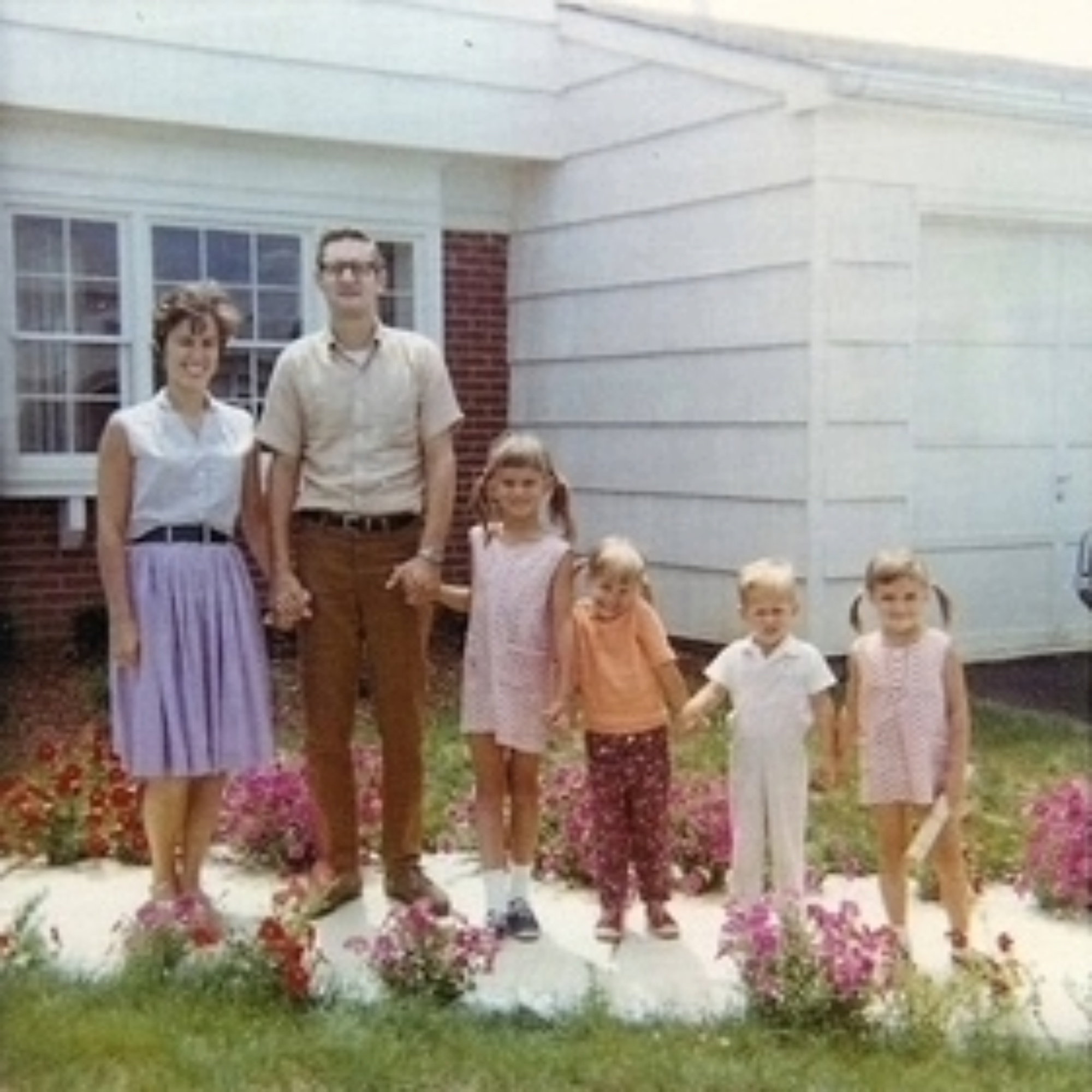 Joan and David Committe, Kathy, Ms. Goetz's cousin, David Committe Jr., her brother, Ms. Goetz, and Susan, another visiting cousin, stand in front of her childhood home. (Photo courtesy of Laura Goetz)