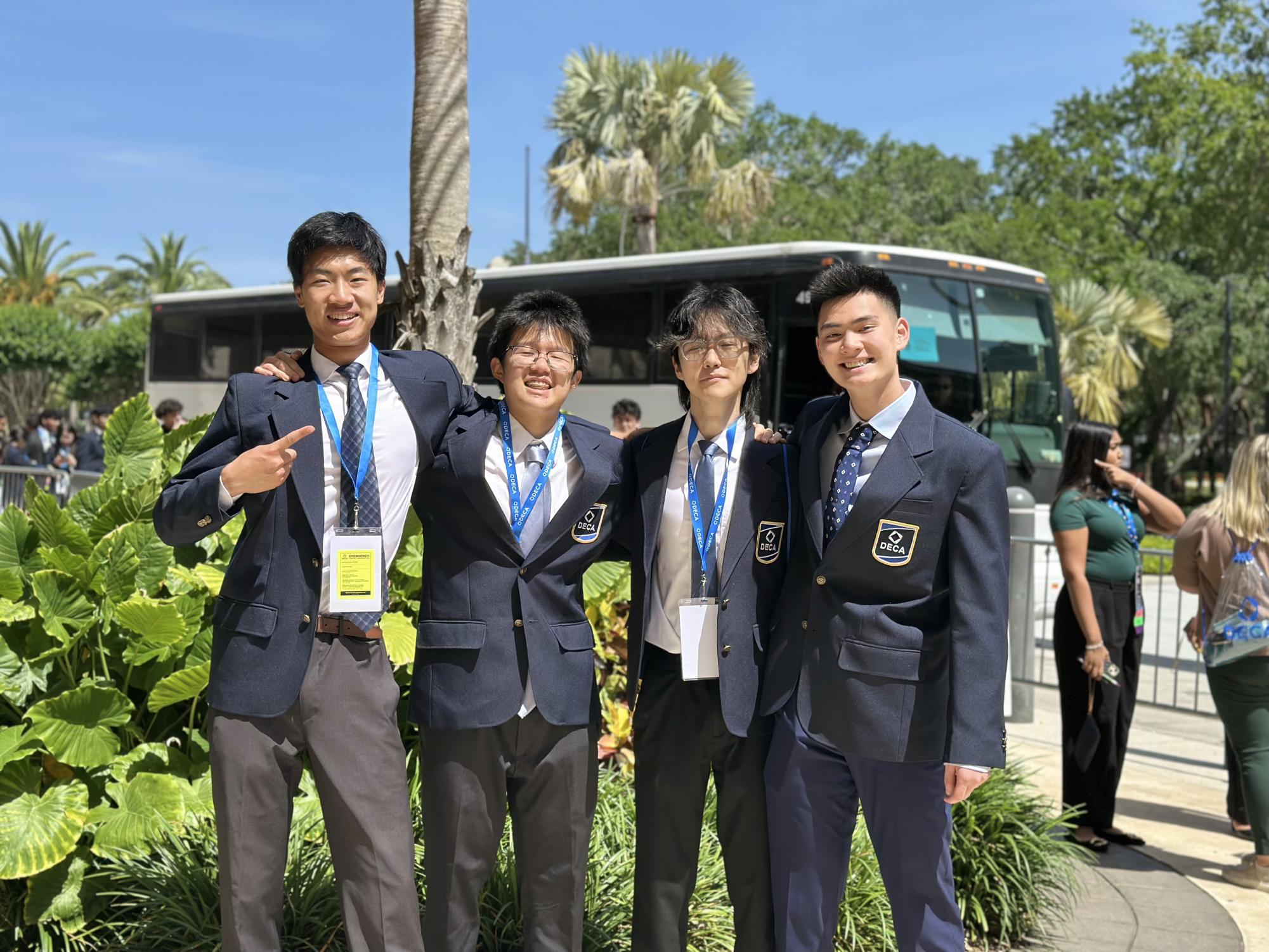 Senior Richard Zhu and juniors Derek Wang, Alvin Wang and Alexander Chen pose in Orlando for the DECA ICDC.