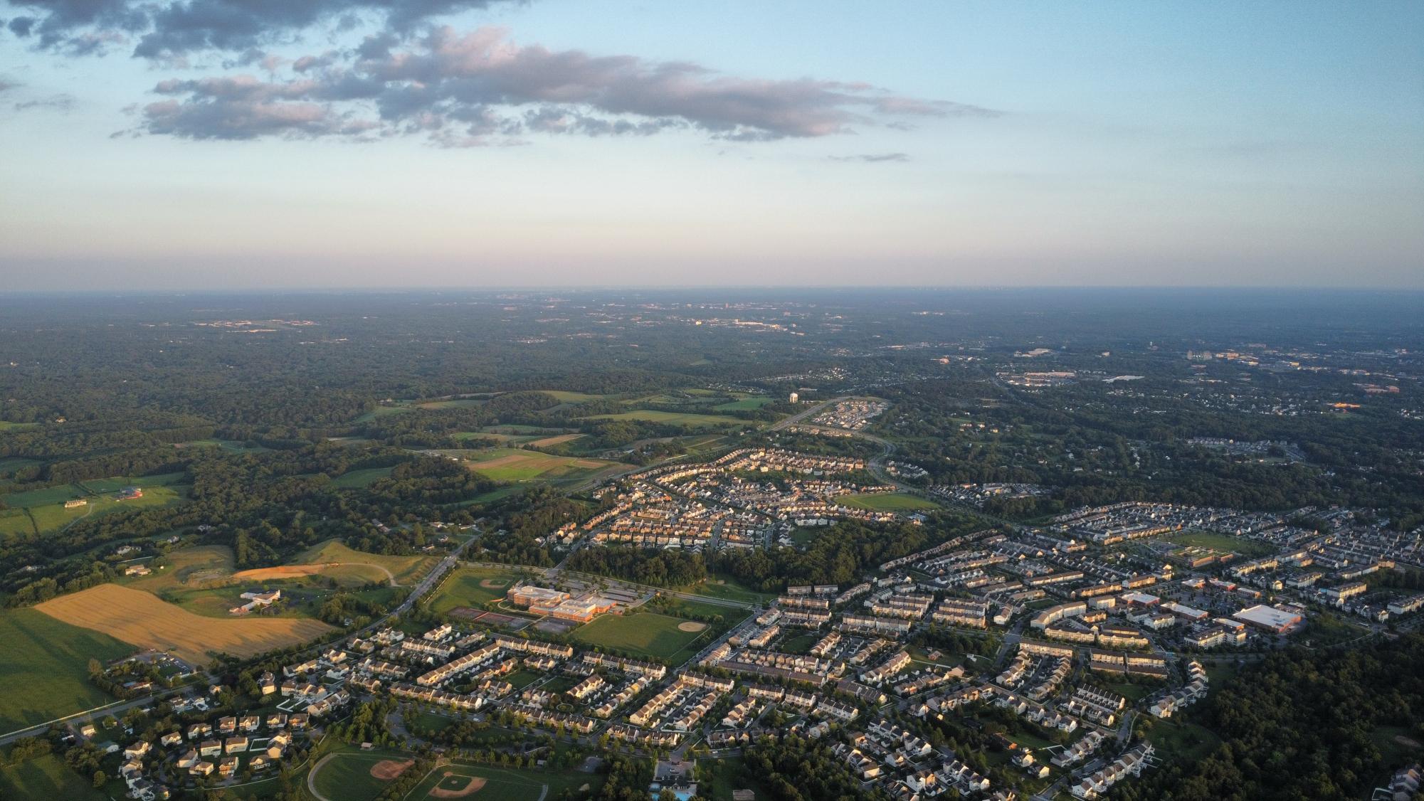 Clarksburg, MD, has seen growth in recent years, with cookie-cutter suburban communities replacing former farmland. Aerial photography from a drone camera allows us to see the scale and uniformity of these new developments. 