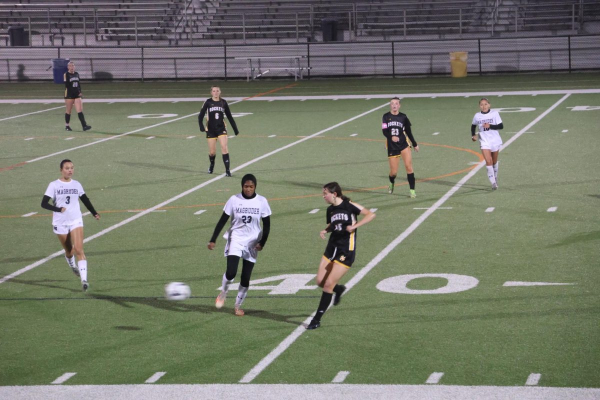 Sophomore Isabel Pearce runs toward an opposing player with the ball against Gaithersburg.