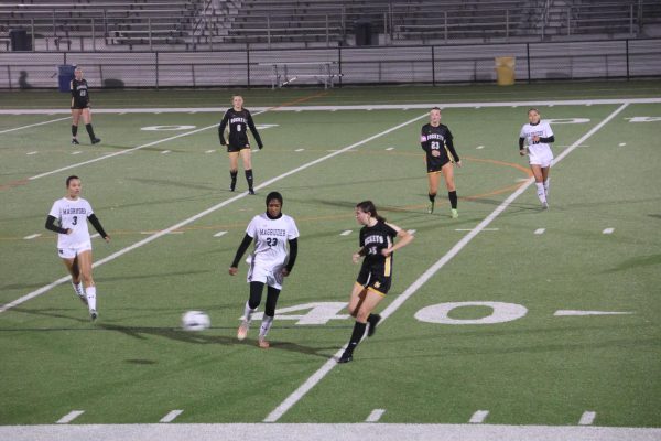 Sophomore Isabel Pearce runs toward an opposing player with the ball against Gaithersburg.