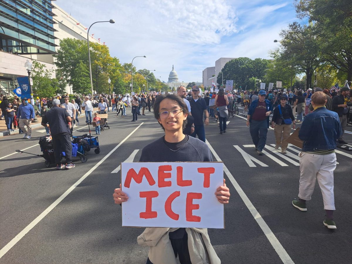 Junior Oliver Lin holds a homemade sign proclaiming "Melt ICE" at a 'No Kings' protest on Pennsylvania Avenue. Controversy over Immigration and Customs Enforcement (ICE) raids across the country is one of the reasons why citizens nationwide turned out in support of the protests.