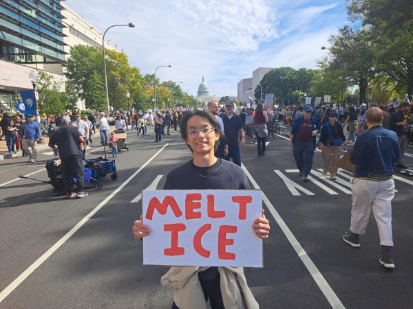Junior Oliver Lin holds a homemade sign proclaiming "Melt ICE" at a 'No Kings' protest on Pennsylvania Avenue. Controversy over Immigration and Customs Enforcement (ICE) raids across the country is one of the reasons why citizens nationwide turned out in support of the protests.