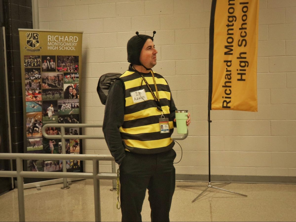 IB administrator Joseph Jelen is dressed as a bumblebee. “I did make this name tag—IB admin,” he said. “I look kind of disgruntled. Like Luke James does,” he said. Some of his past costumes include Jerry Seinfeld and Luke from Gilmore Girls.  He says he enjoys seeing everyone dress up each year. “I think I counted 10 Stitches today from Lilo and Stitch. I appreciated the science department coming strong as members of the zoo, counseling with Black Friday. That was clever. Student costumes…I saw a Jim Halpert. I appreciated that reference,” he said. Students often have unique reactions when they see him dressed up. “I would call it a reserved smile. Right? Like, you can't help but laugh, but they're not sure if they should be laughing out loud,” he said.