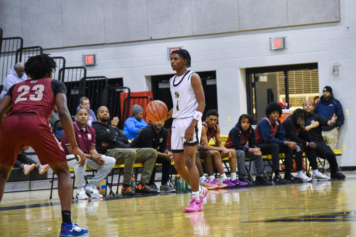 Senior captain Boogie Vaughn-Cooper dribbles down the court in a game against Paint Branch.