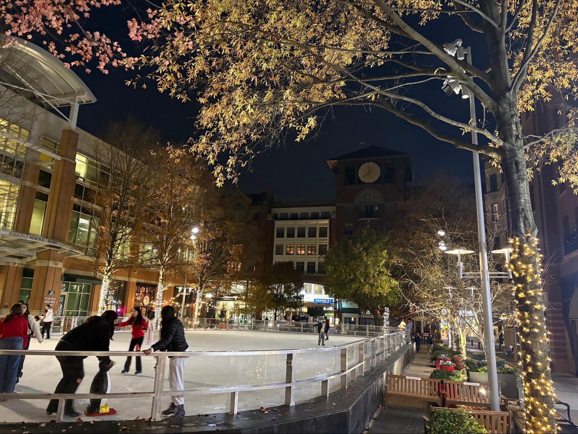 At night, the holiday lights glow in Rockville Town Center, illuminating all the skaters there.