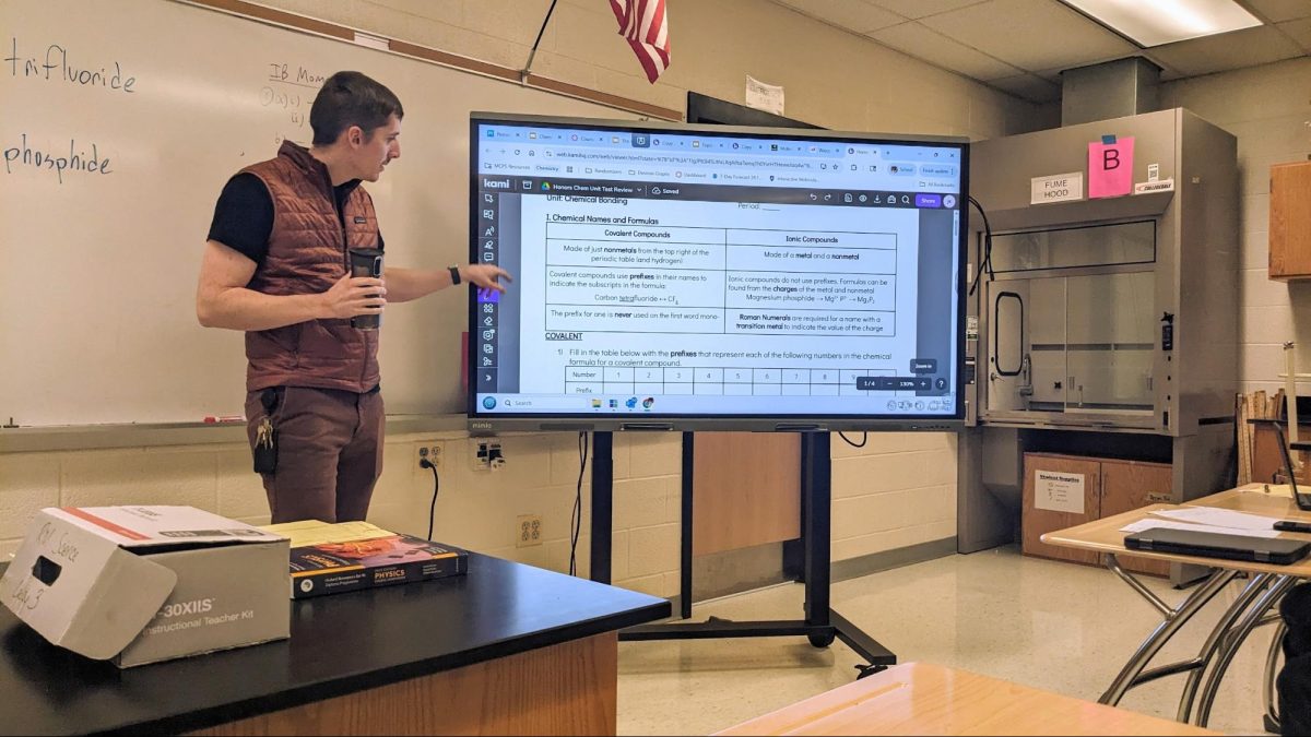 Science teacher James Keil instructs his honors chemistry class.
