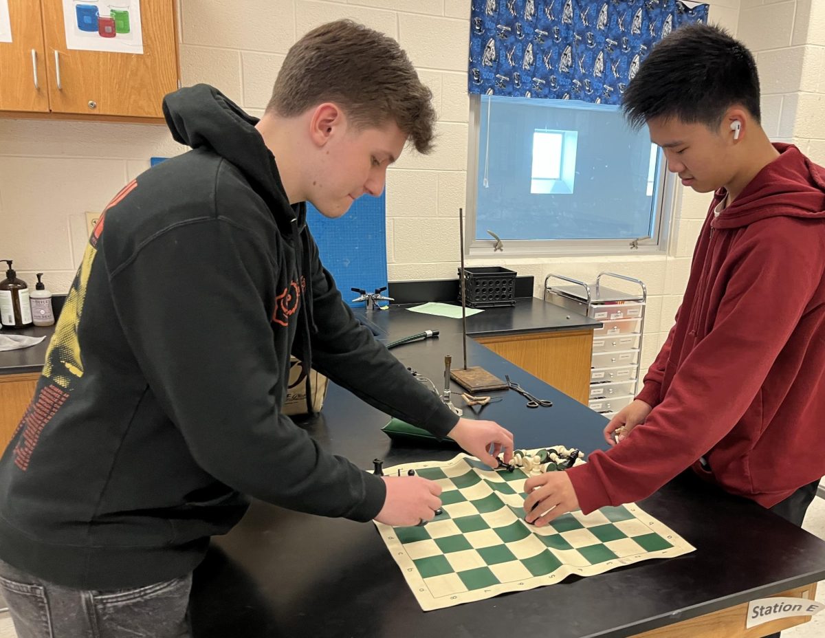 Senior Kris Donchev and sophomore Michael Chen, president and member of the RM Chess Club respectively, prepare for an after-school tournament. 