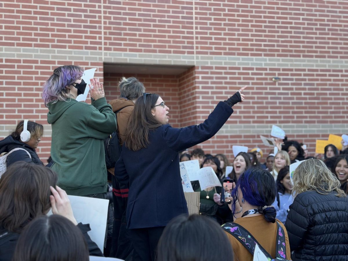 Freshmen Ollie Steckelberg and Julie Boyd lead students in a rally during the school walk-out protesting against ICE on Jan. 20.  
