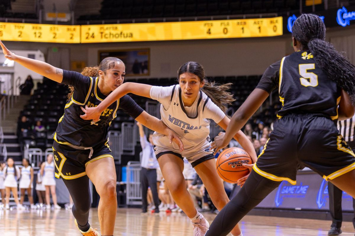 Junior Ava Ruggeri attempts to steal the ball from Whitman' s side. 
