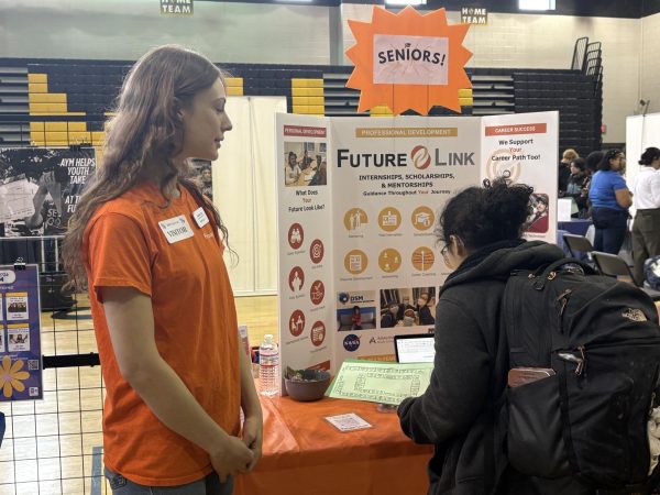 PROMOTING OPPORTUNITIES, Caroline Cain, intern at Future Link, explains the program’s offerings for graduating seniors planning on attending Montgomery College.