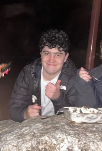 Senior Alessandro Lisa gives a thumbs up during a hangout.