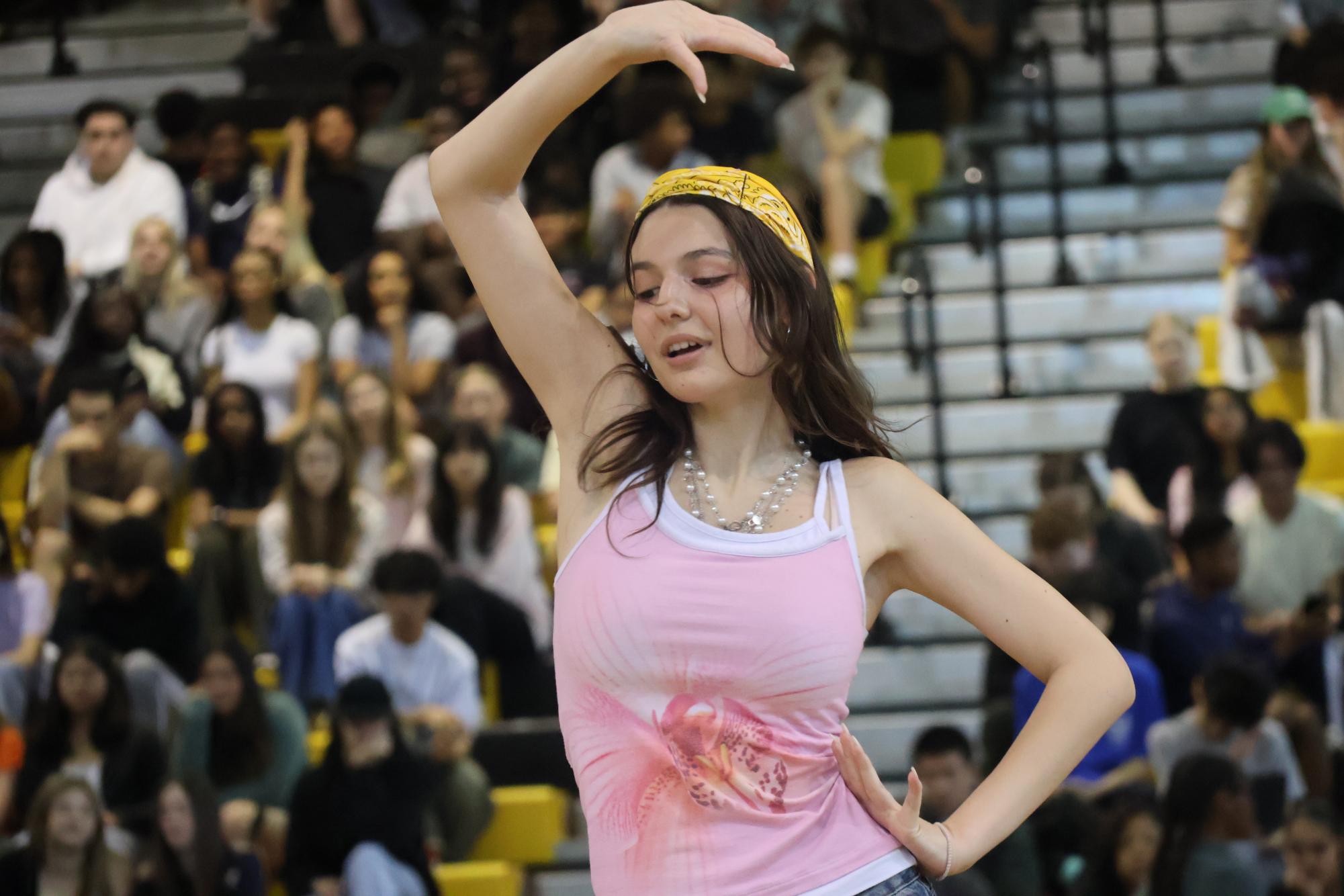 Junior Anastasia Kan sways her arms, dancing to "Little Miss" by Girlset.