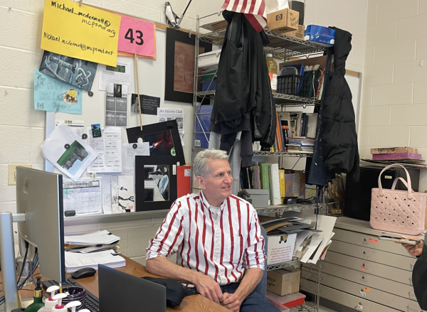 Mr. McDermott discussing with a student in his classroom