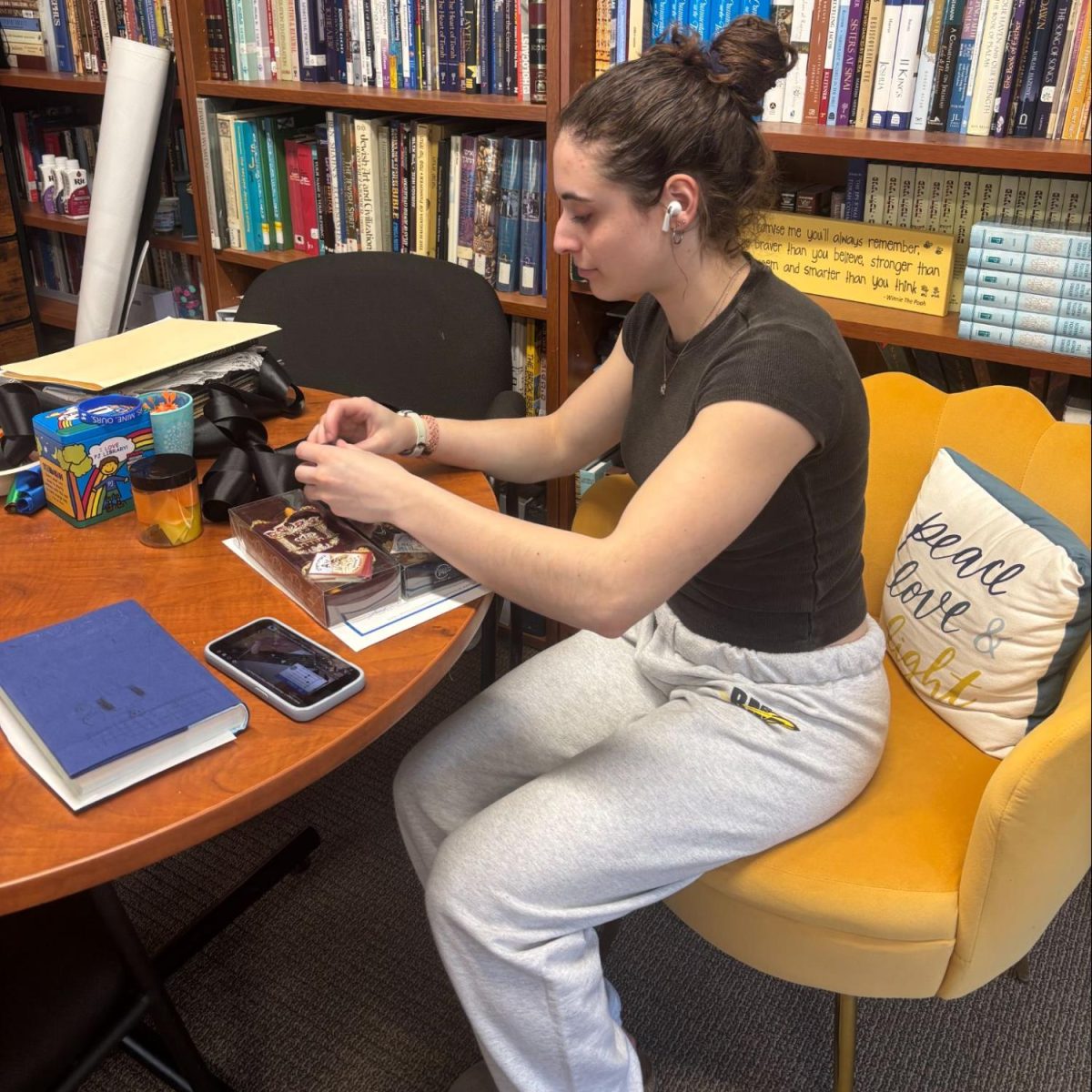 Junior Aviva Peck puts together a Torah play set for the Sunday school class she teaches (Photo courtesy of Lena Tulchin)
